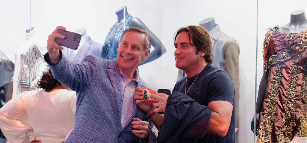 Two men taking a selfie at the Grammy Museum.