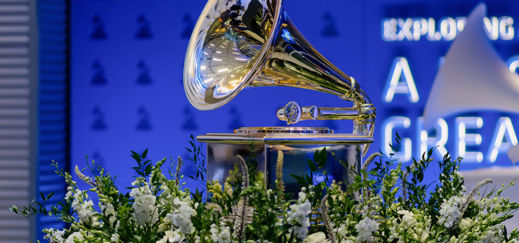 photo of a grammy in a bed of flowers