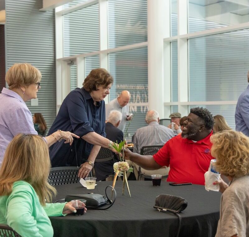 a group of people around a round table