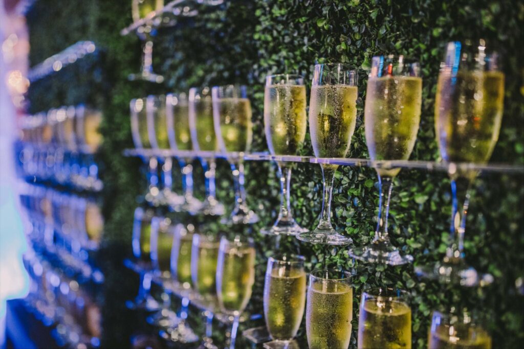 a group of glasses of champagne