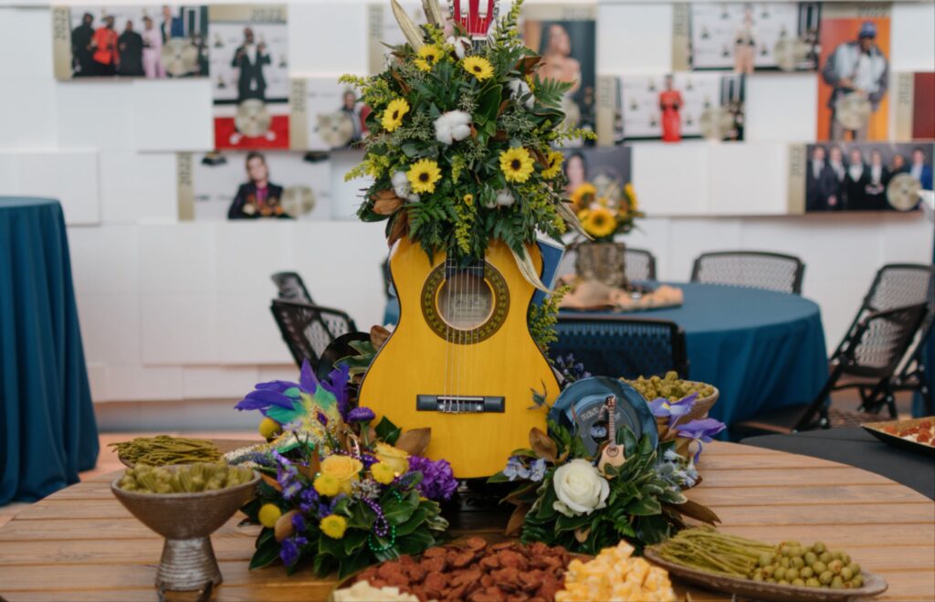 a guitar with flowers on top of it