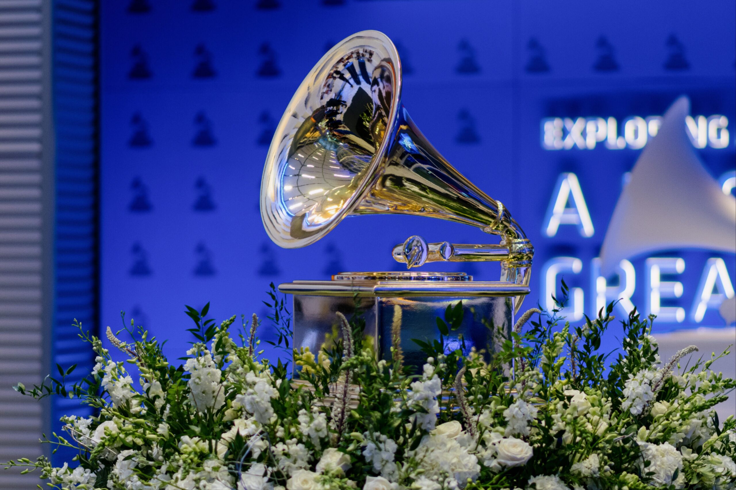 a silver gramophone with white flowers