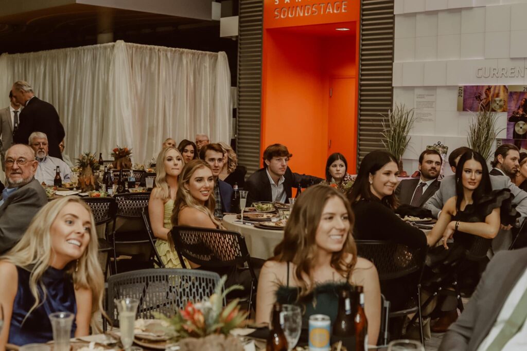 a group of people sitting at tables