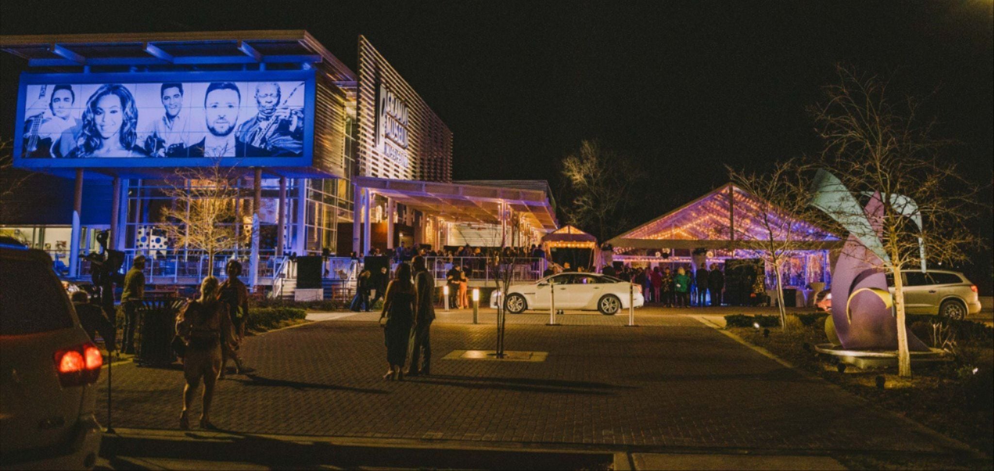 people standing in front of a building